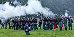 American Civil War re-enactors volley firing with black powder