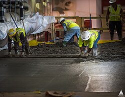 Concrete floor of a parking garage being placed