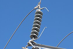 A string of 8 insulators on a 66 kV transmission line