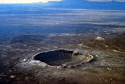 Meteor Crater in Arizona. Created 50,000 years ago by an impactor about 50 metres (160 ft) across, it shows that the accretion of the Solar System is not over.