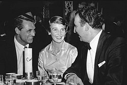 Grant with Betsy Drake and saxophonist Dick Stabile (right) in 1955