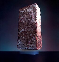 A 2.5 kg brick is supported by a piece of aerogel with a mass of 2 g.