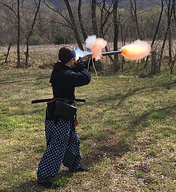 A gunner firing a Japanese tanegashima matchlock.