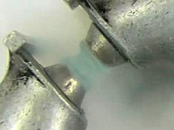 Liquid oxygen, temporarily suspended in a magnet owing to its paramagnetism