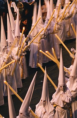 Nazarenos wearing capirotes, in Málaga, Spain