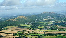 The Malvern Hills located in the English counties of Worcestershire and Herefordshire. The hills have been designated by the Countryside Agency as an Area of Outstanding Natural Beauty.