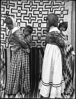 Two young Walapai Indian mothers with their children on their backs, Hackbury, Arizona, c. 1900