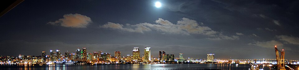 The downtown San Diego skyline seen at night. At 2.1 miles (3.4 km) long, the Coronado Bay Bridge stands as the longest bridge in the region and Southern California.
