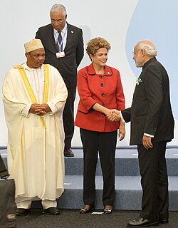 The Indian prime minister, Narendra Modi greeting the president of Brazil, Dilma Rousseff, in background Portuguese prime minister António Costa at the COP21 Summit on 30 November 2015