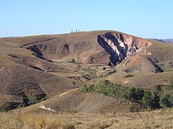 Active headward erosion (lavaka) on right, with inactive, largely infilled older examples to left