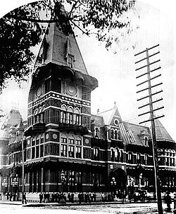 An ornate Victorian Gothic style building with a square tower
