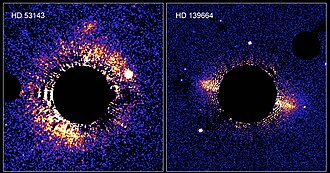 Debris discs around the stars HD 139664 and HD 53143 – black circle from camera hiding stars to display discs.