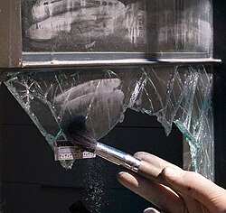 Fingerprint dusting of a burglary scene