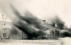 The Fly photography studio burning in July 1912. Photograph by Mollie Fly.