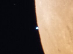 Uranus seen through an amateur telescope, shortly after lunar occultation, during the November 2022 lunar eclipse