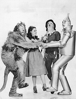 Bert Lahr, Judy Garland, Ray Bolger and Jack Haley in The Wizard of Oz (1939), which since its release became one of MGM's most iconic and beloved films.