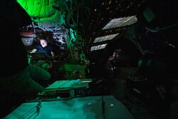 The inside of Integrity and the crew working during flight