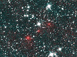 The existence of Comet NEOWISE (here depicted as a series of red dots) was discovered by analyzing astronomical survey data acquired by a space telescope, the Wide-field Infrared Survey Explorer.