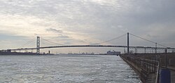 View of the bridge from the Detroit River, with Canada to the left