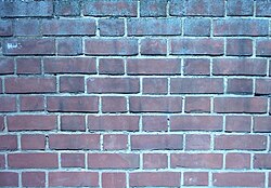 A brick wall built using Flemish bond