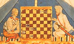 A Christian and a Muslim play chess in 13th-century al-Andalus.