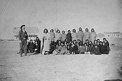 Cheyenne captives, taken at Fort Dodge, Kansas en route to the stockade at Fort Hays; to the left stands U.S. Army chief of scouts John O. Austin.