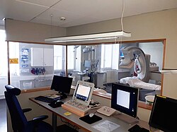 Fluoroscopy room with control space separated by lead shielding glass