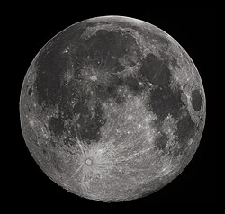 The dark and relatively featureless lunar plains, clearly seen with the naked eye, are vast solidified pools of ancient lava called maria.