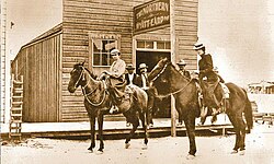 Wyatt Earp's Northern Saloon, Tonopah, Nevada, c. 1902. The man in the center is believed to be Wyatt Earp, and the woman on the left is often identified as Josephine Earp