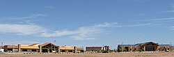 Buildings in Alamogordo: PreCheck headquarters, Aviator 10 Theater, and the US Department of Agriculture / Forest Service building.
