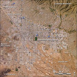 Tucson, as seen from space: The city's four major malls are indicated by blue arrows.
