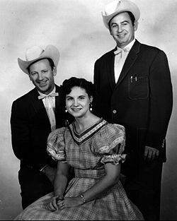 Johnnie Wright (left) and Jack Anglin (right) with Kitty Wells (center)
