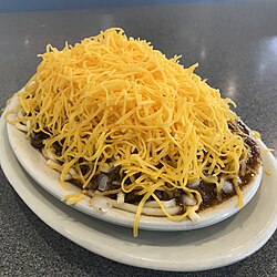 Cincinnati chili (pictured here as a "four-way") is a Mediterranean-spiced meat sauce used as a topping for spaghetti or hot dogs.