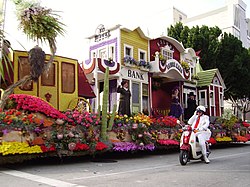 A float and a "White Suiter" volunteer