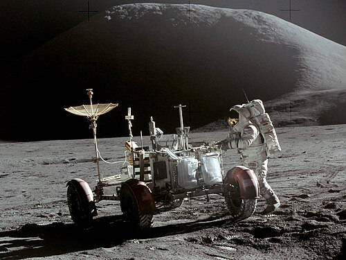 Astronaut works on the Moon at the lunar rover