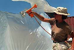 The US military shrink-wraps equipment such as helicopters to protect them from corrosion, thus saving millions of dollars
