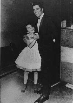Lee poses with Elvis Presley, 1957.