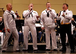 Barbershop quartets, such as this US Navy group, sing 4-part pieces, made up of a melody line (normally the second-highest voice, called the "lead") and 3 harmony parts.