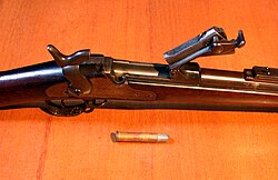 Springfield trapdoor rifle with breech open. Custer's troopers were equipped with these breech-loading, single-shot rifles.