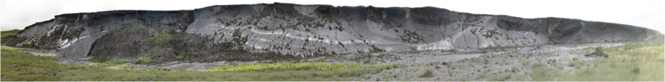 Cliff wall of a retrogressive thaw slump located on the southern coast of Herschel Island within an approximately 22-metre (72 ft) by 1,300-metre (4,300 ft) headwall.