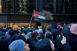 A Palestinian flag flown in the crowd of Zohran Mamdani's inauguration