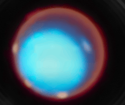 A near infrared time lapse of the upper atmosphere of Uranus,[112] taken by the James Webb Space Telescope. Blue represents the planet's lower atmosphere, while red represents higher altitudes.