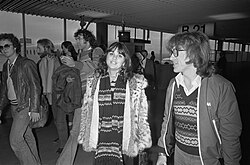 Ronstadt with producer Peter Asher and her band, 1976