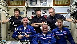 Expedition 59 crew members Anne McClain, Oleg Kononenko, and David Saint-Jacques welcome their new crew members, Nick Hague, Alexey Ovchinin, and Koch (bottom right) who arrived at the International Space Station on March 14, 2019.