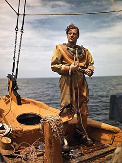 Sponge diver putting on his diving suit in Tarpon Springs, Florida.