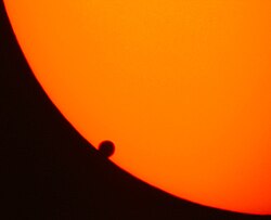Venus transits the face of the Sun on June 8, 2004, providing valuable information on the upper atmosphere through spectroscopic measurements from Earth