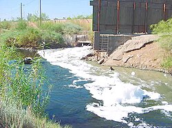 Water pollution is an environmental issue that affects many water bodies. This photograph shows foam on the New River as it enters the United States from Mexico.