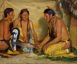 Blackfoot making sweet grass medicine for a ceremony.