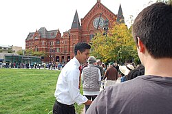 Pureval shaking hands at a rally for Hillary Clinton's presidential campaign in October 2016