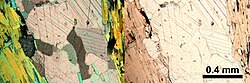 Photomicrographs of a thin section containing carbonate vein in mica rich rock. In cross-polarized light on left, plane-polarized light on right.